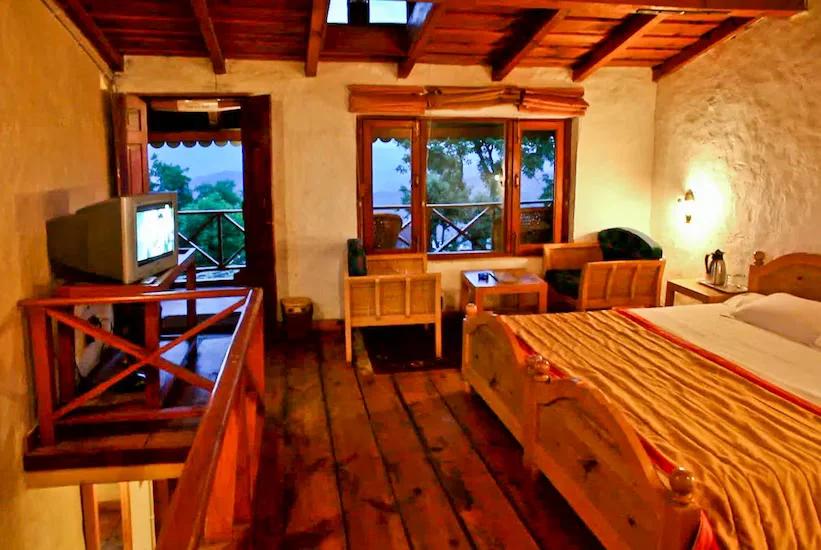 a bedroom at chevron eco lodge in kasauni hotel_Image