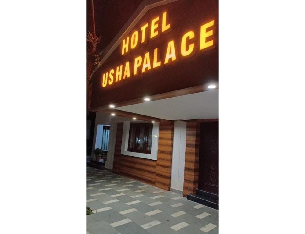 a hotel name on wall at staybook hotel usha palace in Mussoorie hotel_Image