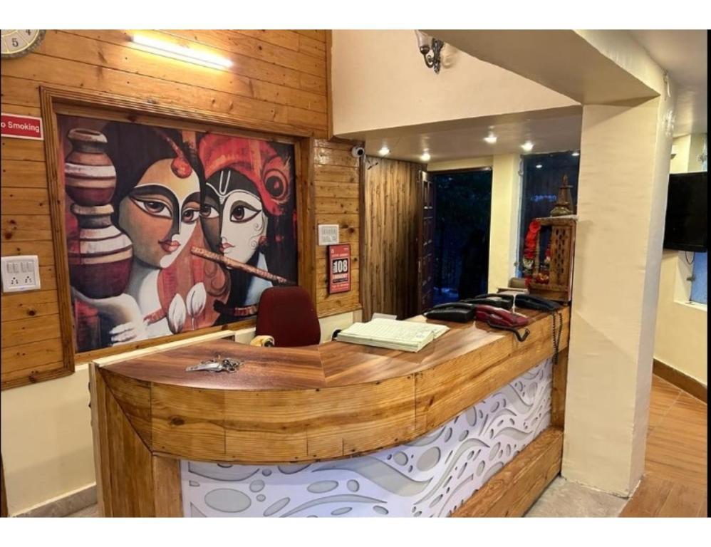 a reception desk at staybook hotel usha palace in Mussoorie hotel_Image