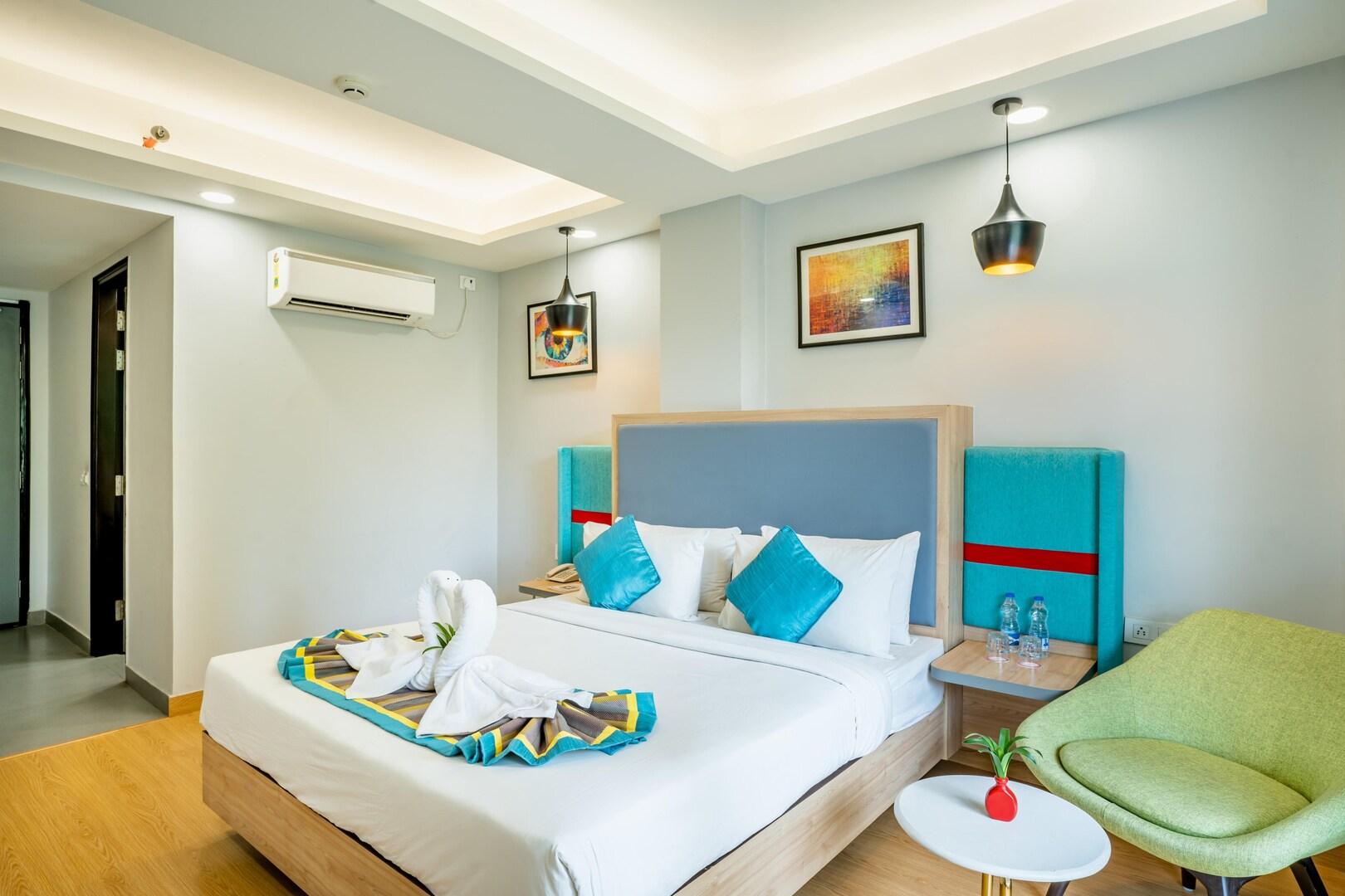 a bedroom with a large bed and a ac at Inde Hotel Golf Course Extn road in Gurugram hotel_Image