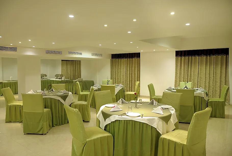 a hotel with dinner area and chair & table at the grand radiant in lucknow hotel_Image